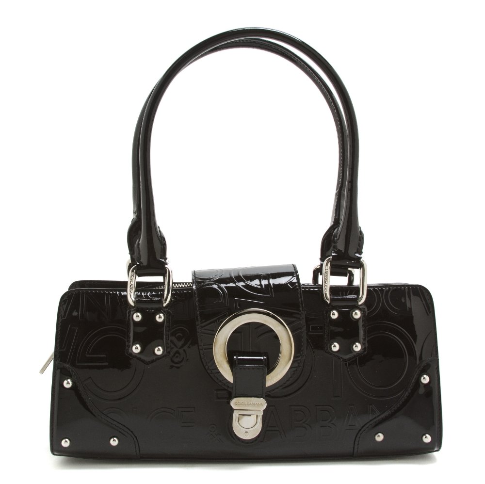 A Dolce and Gabbana Black Patent Leather Bag, 11 1: A Dolce and Gabbana Black Patent Leather Bag, two top handles, allover logo embossing, silvertone hardware, zipper closure with additional flap and clasp, leopard print fabric lining. Stamped: Dolce &