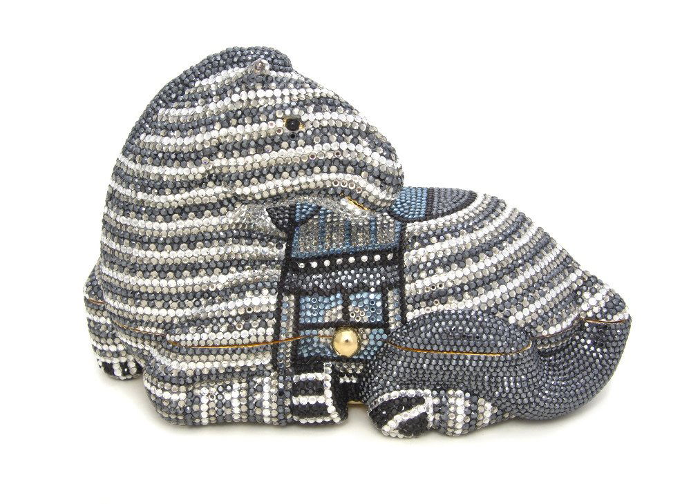 A Judith Leiber Crystal Zebra Minaudiere,: A Judith Leiber Crystal Zebra Minaudiere, black and silver crystals with black cabochon eyes and a light blue crystal saddle, goldtone push clasp, goldtone hardware, gold kid leather lining, includes