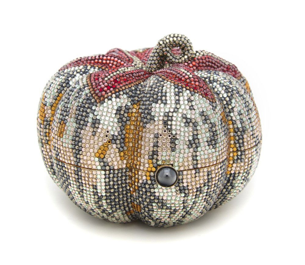 A Judith Leiber Crystal Pumpkin Minaudiere,: A Judith Leiber Crystal Pumpkin Minaudiere, silver, gray, red and amber crystals, gunmetal cabochon push clasp, goldtone hardware, chainlink hidden shoulder strap, gold kid leather lining, includes co