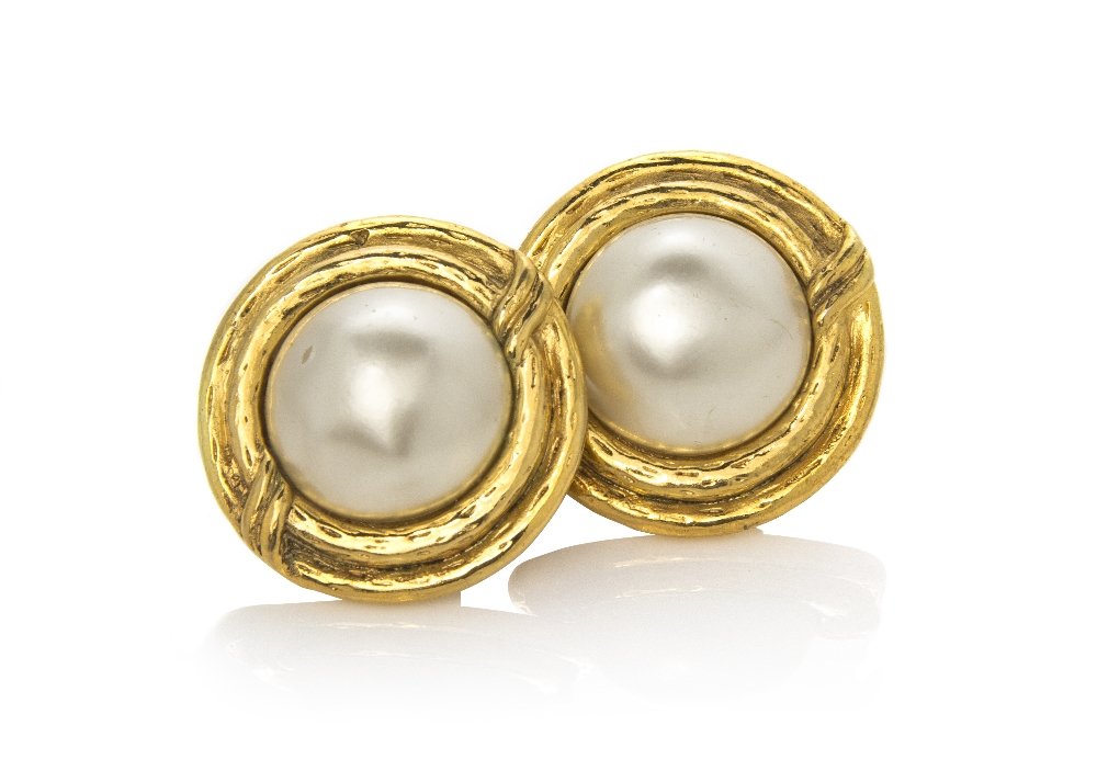 A Pair of Chanel Faux Pearl and Goldtone Earclips,: A Pair of Chanel Faux Pearl and Goldtone Earclips, with a double ring border. Stamped: Chanel.
