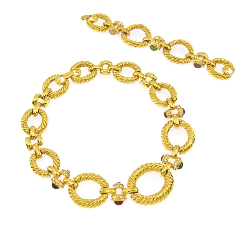 A Givenchy Twisted Goldtone and Multigem Cabochon : A Givenchy Twisted Goldtone and Multigem Cabochon Suite, comprised of a bracelet and necklace. Stamped: Givenchy. Property from an Important Collector, Chicago, Illinois