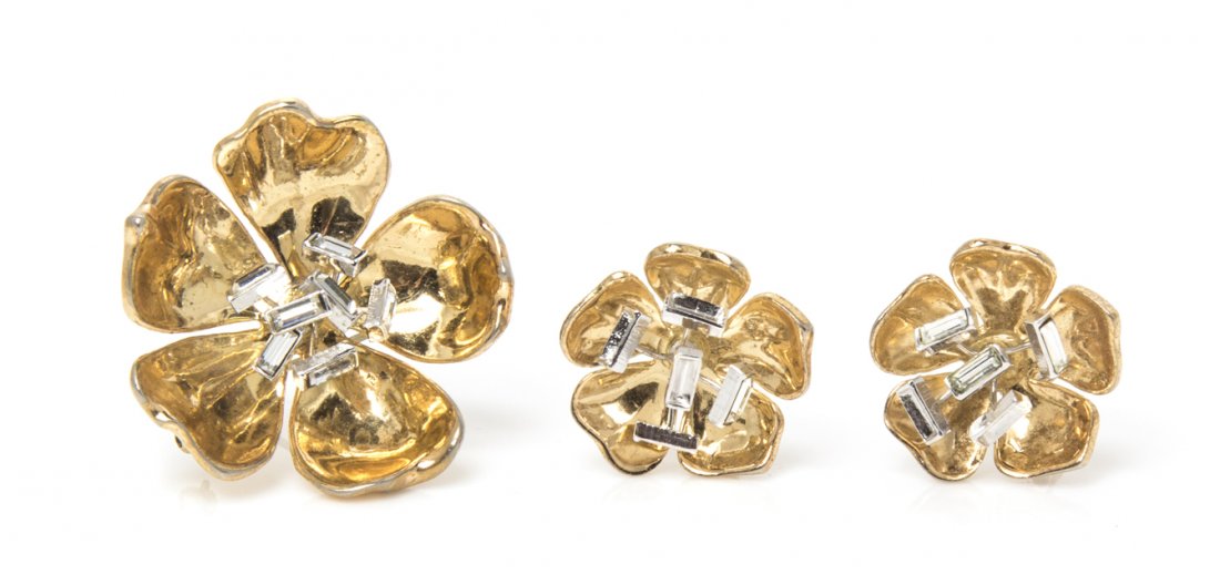 A Trifari Goldtone and Rhinestone Flower Suite,: A Trifari Goldtone and Rhinestone Flower Suite, comprised of a brooch and earclips. Stamped: Trifari. Property from an Important Collector, Chicago, Illinois