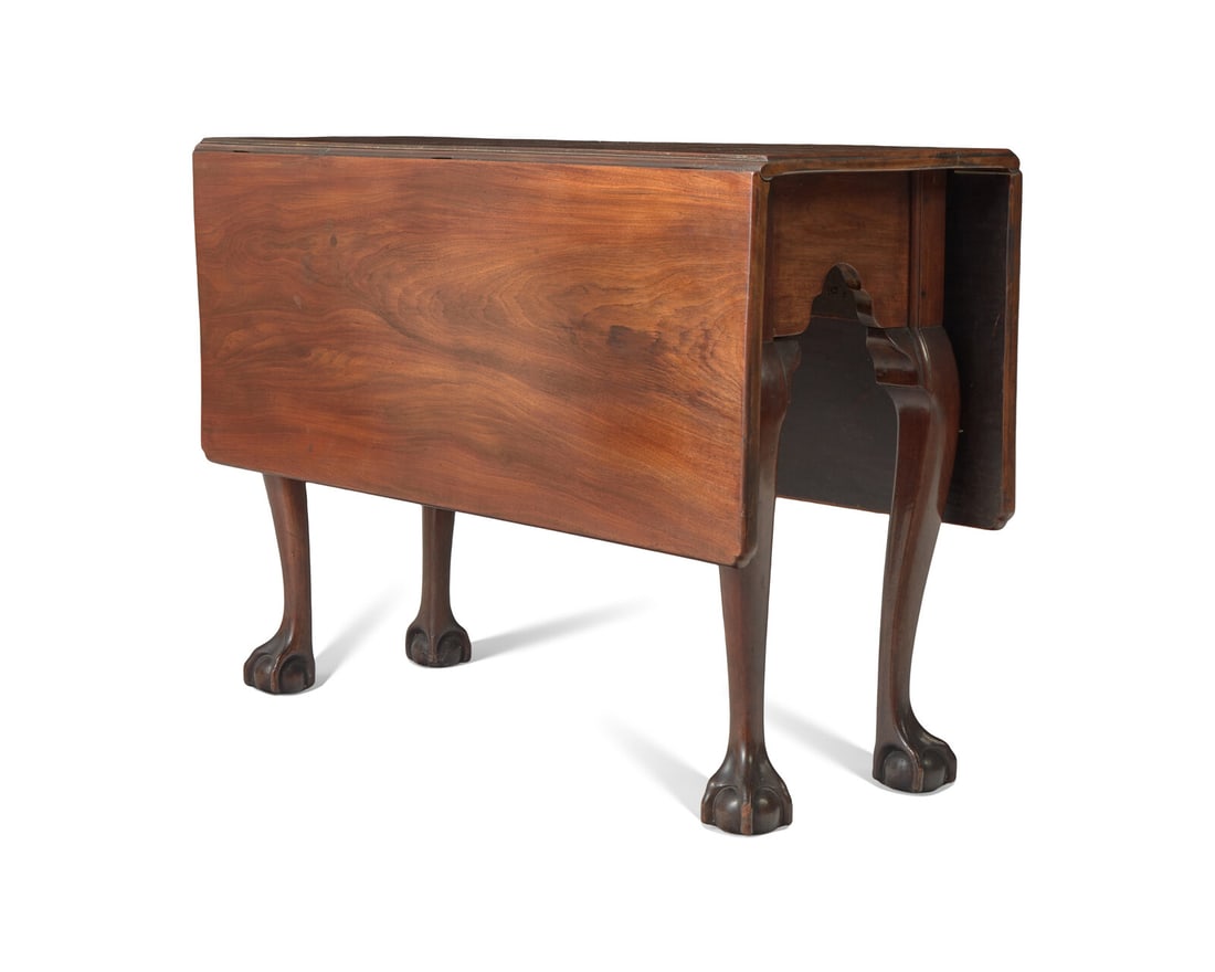 A Chippendale Carved and Figured Mahogany Drop-Leaf Dining Table, Philadelphia, PA, Circa 1775: A Chippendale Carved and Figured Mahogany Drop-Leaf Dining Table, Philadelphia, PA, Circa 1775 With shaped leaves, on cabriole legs ending in ball-and-claw feet. H: 28 1/2 in. W: 41 1/2 in. D: 16 in. 