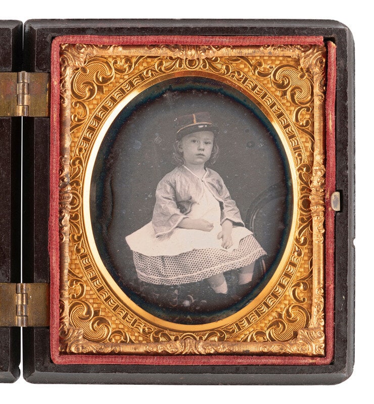[CIVIL WAR]. Likely pre-war sixth plate daguerreotype portrait of a young girl wearing a kepi.  (1 of 2)