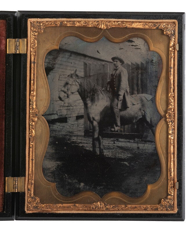 [EARLY PHOTOGRAPHY]. Half plate ambrotype of man on horseback with Washington Monument Union case.  (1 of 3)