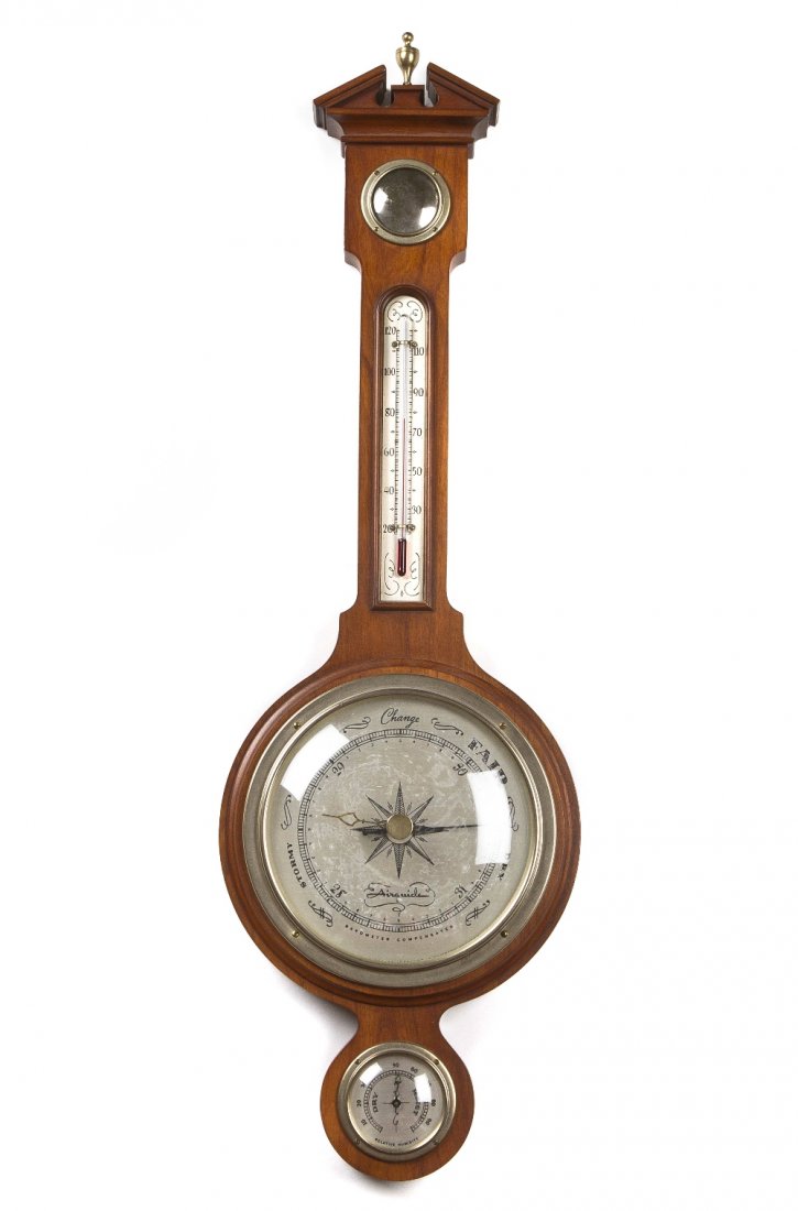 An American Mahogany Wheel Barometer, Airguide, Hei: An American Mahogany Wheel Barometer, Airguide, of typical form, having an urn form finial above a convex mirror and barometer. Height 29 1/2 inches. Property from the Estate of a Florida and Southamp
