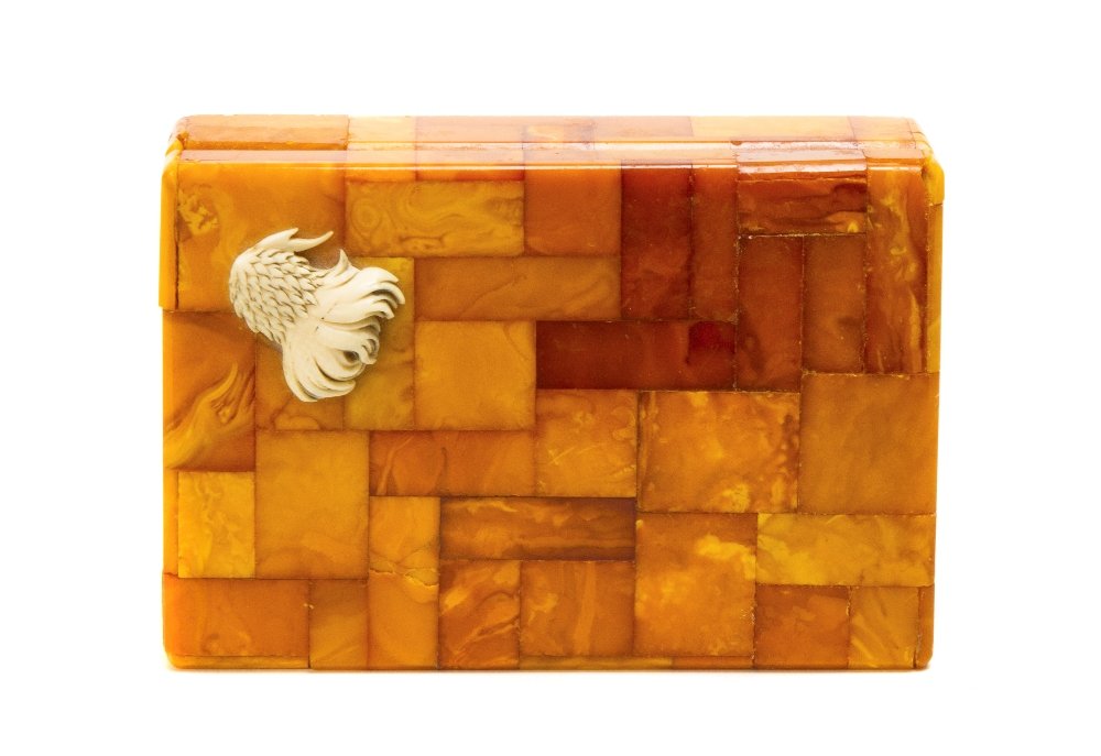 An Amber Veneered and Ivory Applied Box, Height 1 1: An Amber Veneered and Ivory Applied Box, of rectangular form. Height 1 1/2 x width 5 1/2 x depth 3 3/4 inches. Property from a Private Collection, Hollywood, Florida