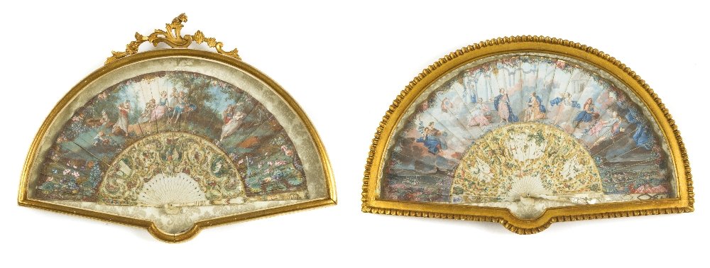 Two French Ivory and Paper Fans, Height overall 17: Two French Ivory and Paper Fans, of demilune form, the first depicting figures in a landscape, the pierced ivory handle painted with two figural scenes, the second depicting classical figures, the mot