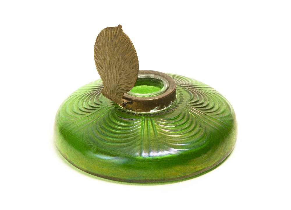 An Iridescent Inkwell, Loetz, Diameter 5 1/4 inche: An Iridescent Inkwell, Loetz, of low circular form, the hinged leaf with stylized lid. Diameter 5 1/4 inches.