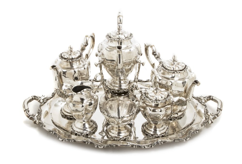 A Mexican Sterling Silver Tea and Coffee Service, : A Mexican Sterling Silver Tea and Coffee Service, comprising coffee pot, teapot, creamer, a covered sugar, waste bowl, hot water kettle on stand with insulators; approximate weight of weighable 261.96
