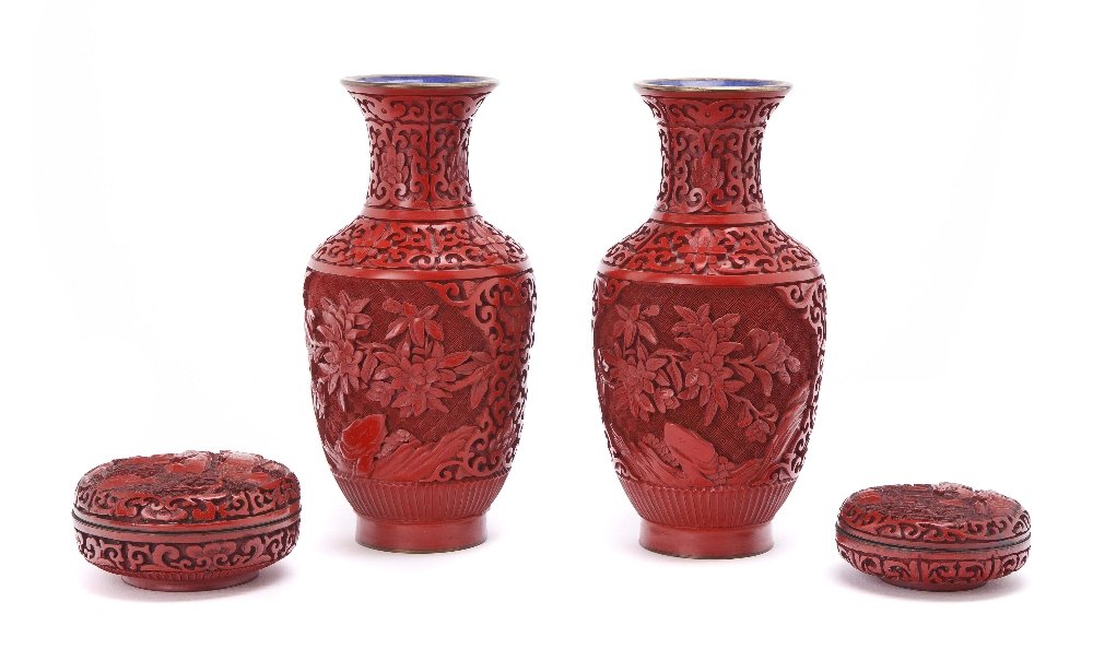Two Chinese Cinnabar Lacquer Boxes, Diameter of la: Two Chinese Cinnabar Lacquer Boxes, of circular form, decorated with landscapes, together with two faux cinnabar vases. Diameter of larger 3 3/4 inches. Property from the Estate of a Florida and South