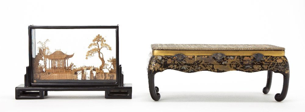 A Japanese Gilt and Lacquer Stand, Height of first: A Japanese Gilt and Lacquer Stand, having an upholstered rectangular top over three short drawers, raised on C-scroll legs, together with a Chinese cork diorama of a landscape with cranes. Height of f