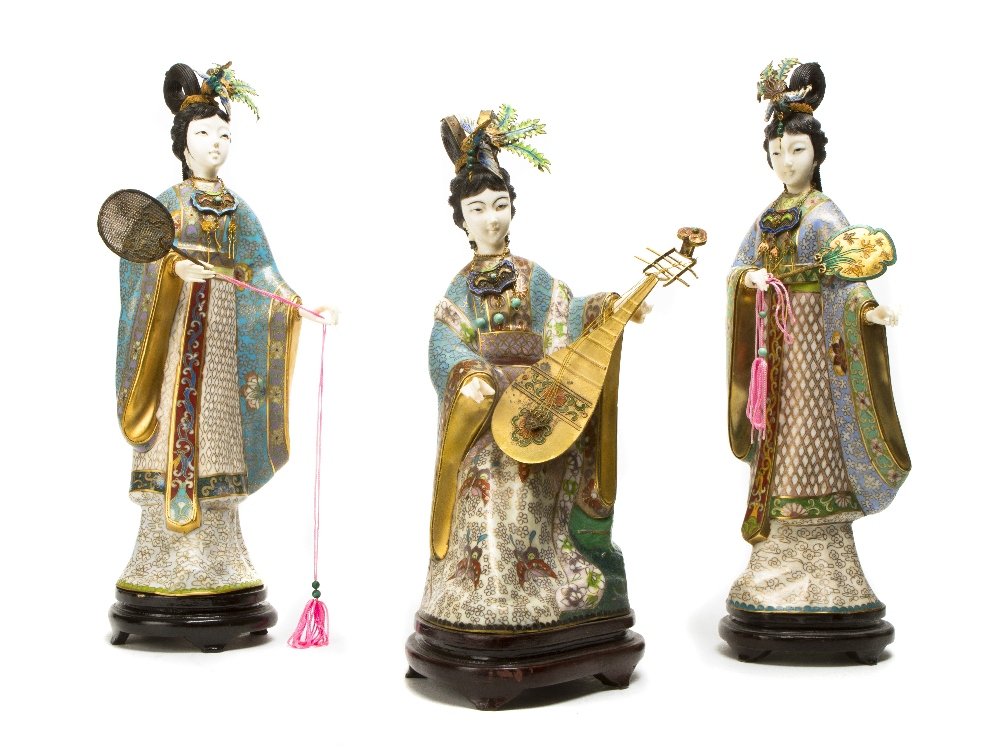 A Set of Three Cloisonne Figures, Height of talles: A Set of Three Cloisonne Figures, each depicting a robed maiden with composite head and hands, set on fitted wood bases. Height of tallest 13 3/4 inches. Property from the Estate of Norman Frost, Napl