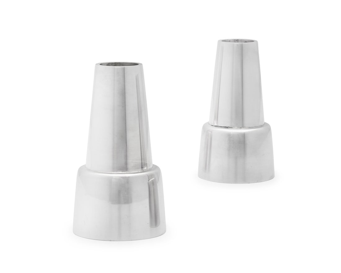 A Pair of Henning Koppel Designed Georg Jensen Silver Candlesticks: A Pair of Henning Koppel Designed Georg Jensen Silver Candlesticks Copenhagen, Circa 1945-77 pattern 1151. marked 'Sterling' on underside 7 ozt Height 3 3/4 inches. This lot is located in Philadelphia