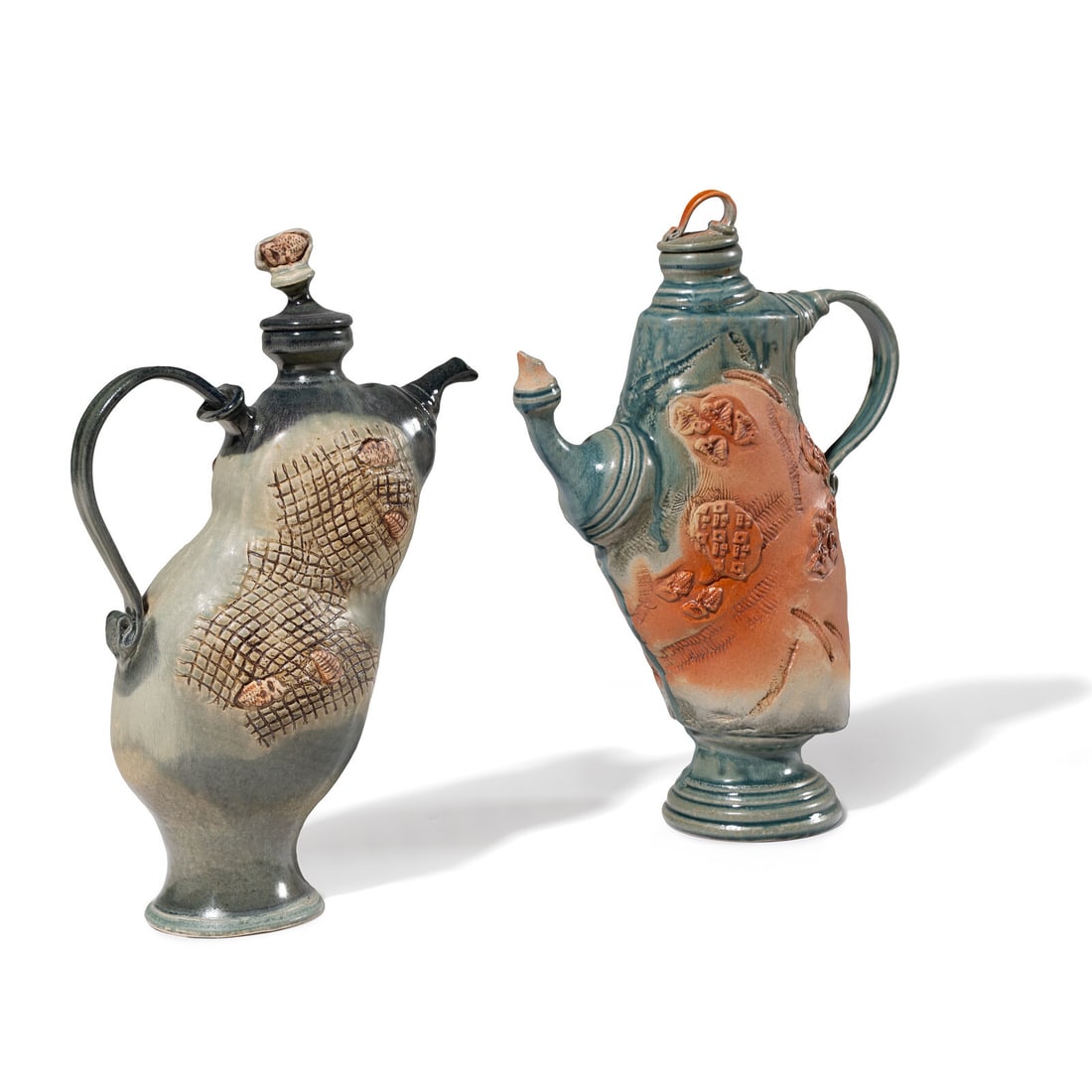 Robert Wilson (American, b. 1945) Two Thrown-Altered Teapots: Robert Wilson (American, b. 1945) Two Thrown-Altered Teapots glazed porcelain signatures to undersides Taller: 16 1/2 h x 11 1/2 w x 4 1/2 d inches. This lot is located in Chicago.