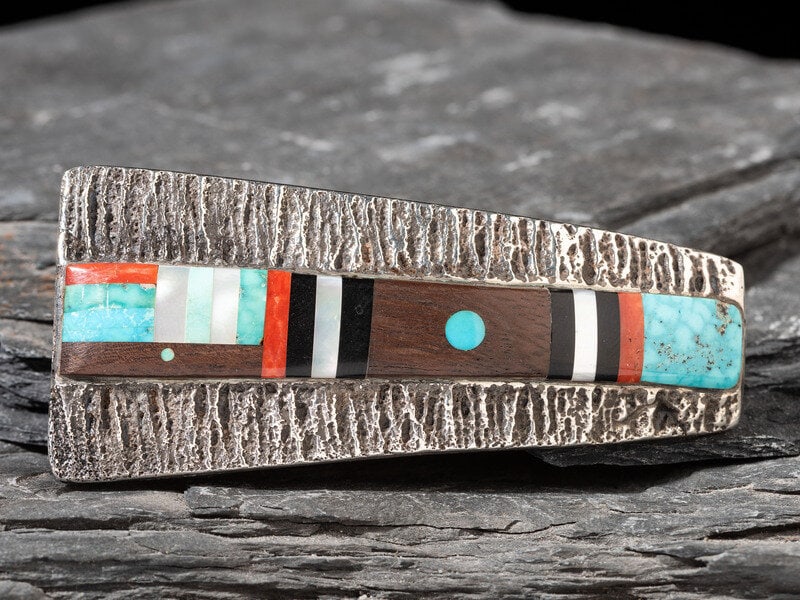 Preston Monongye 
(Mission-Adopted Hopi, 1927-1987)
Tufa Cast Silver Belt buckle, with Mosaic Inlay  (1 of 2)