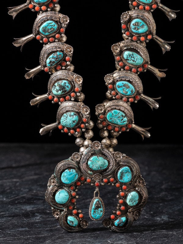 Beverly Thomas
(Diné, 20th century)
Silver, Turquoise, and Coral Squash Blossom Necklace (1 of 2)