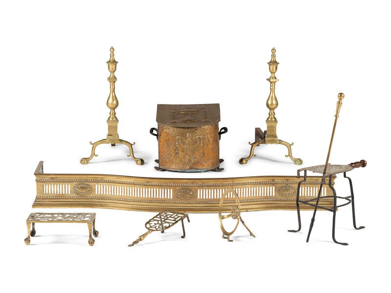 A Group of Brass Fireplace Articles: A Group of Brass Fireplace Articles 18th Century and Later including a coal box, fender, poker, trivets, and andirons. Length of fender 54 inches. This lot is located in Cincinnati.