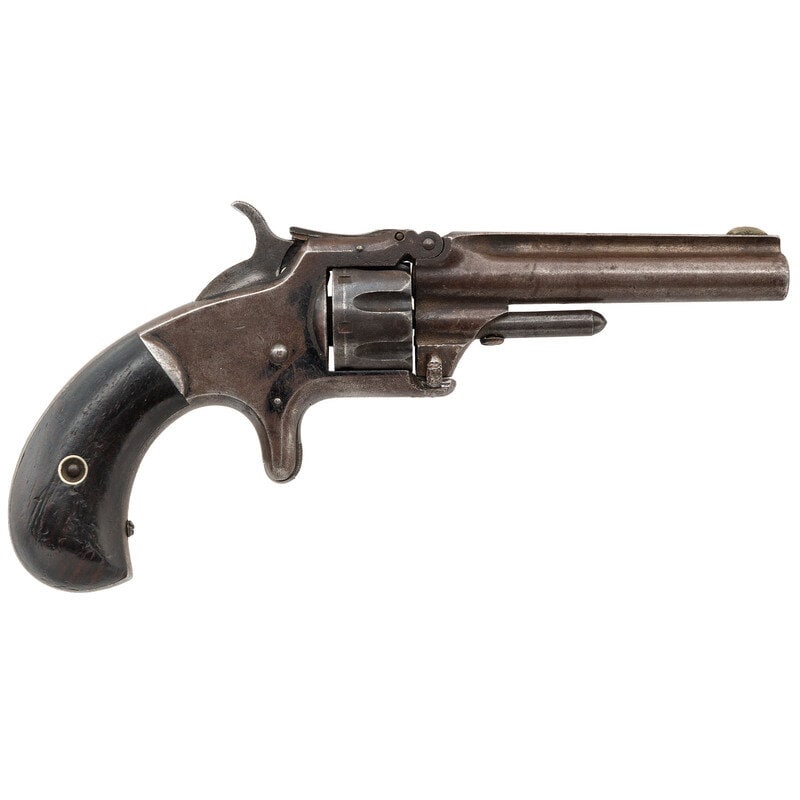 Smith & Wesson Model 1 Third Issue: Smith & Wesson Model 1 Third Issue .22 Short. 3.125" barrel length. SN: 20844. Blued metal finish with varnished rosewood birdshead grips mounting German Silver front blade and cylinder stop rear