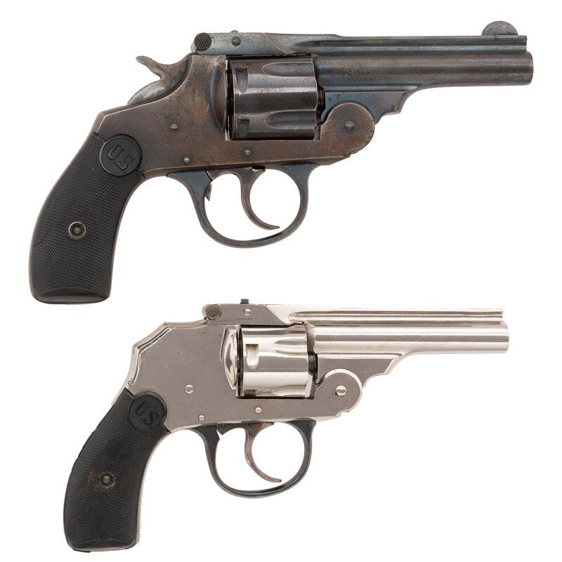 **Two US Revolver Co. Top Breaks: **Two US Revolver Co. Top Breaks 1.) .32 S&W. 3" ribbed barrel. SN: B21846. Nickel plated finish with case colored trigger mounting blued triggeruard, checkered hardrubber U.S. logo grips, and a f