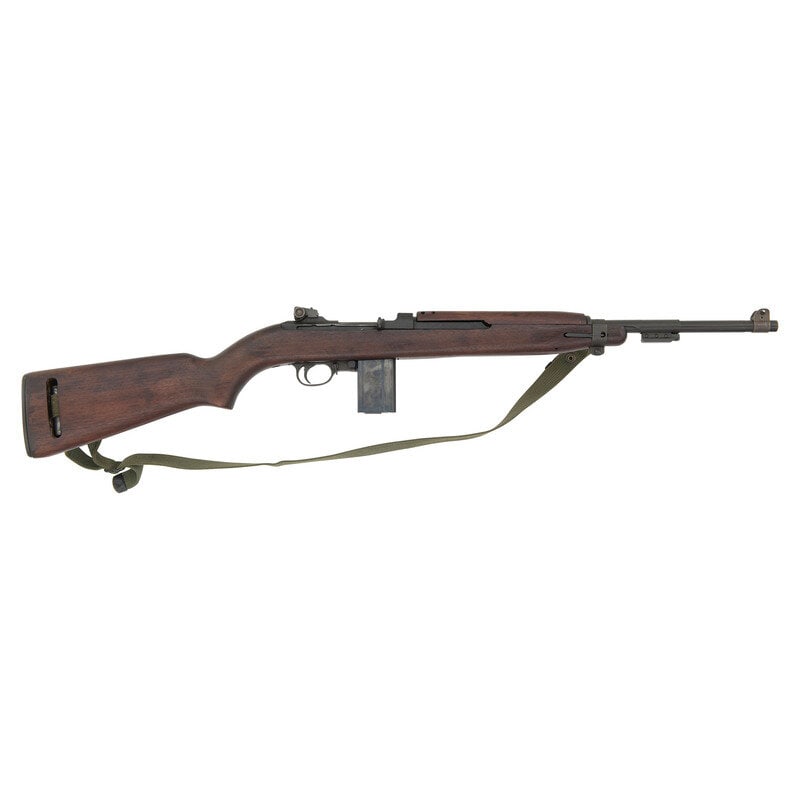 **Quality Hardware U.S. M1 Carbine: **Quality Hardware U.S. M1 Carbine .30 M1 carbine. 18" barrel length. SN: 1930904. Parkerized metal finish. Semi pistol grip walnut stock with four rivet handguard, low wood, and an oval oiler cutaway
