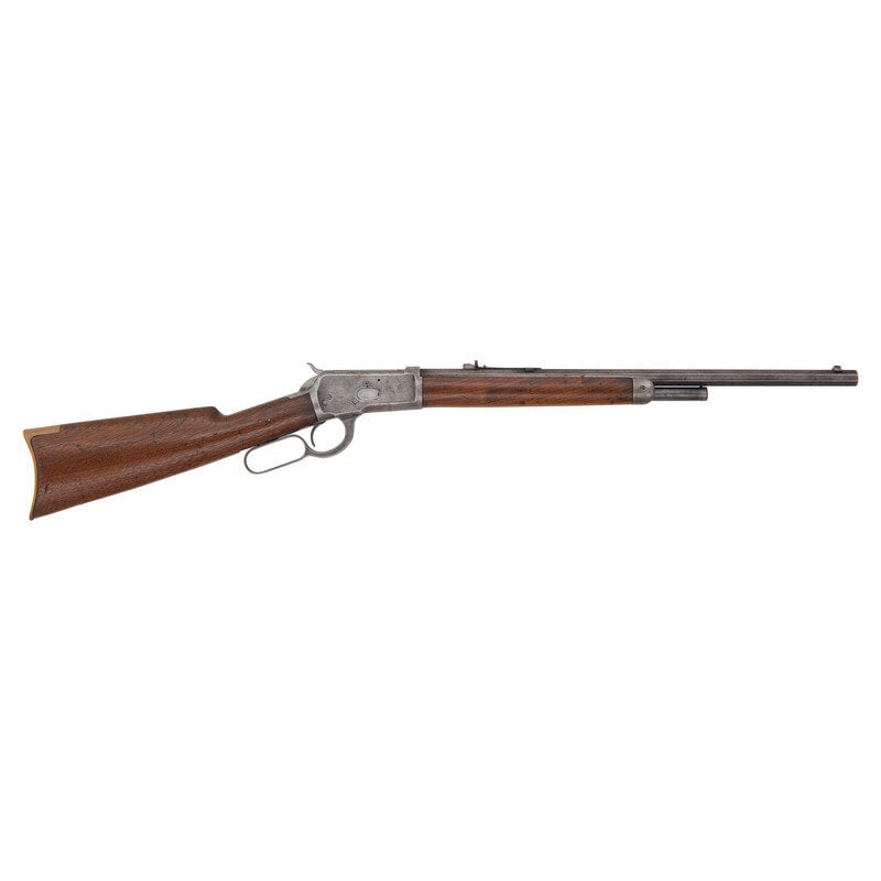 **Winchester Model 1892 Saddle Ring Carbine in .38 WCF: **Winchester Model 1892 Saddle Ring Carbine in .38 WCF .38 WCF. 20" barrel length. SN: 220391. Blued metal finish with octagonal barrel set in walnut straight wrist stock with half length magazine tub