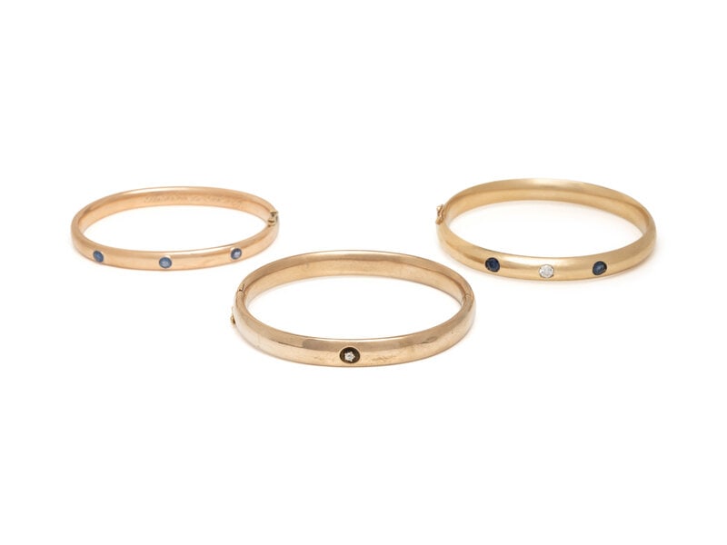 COLLECTION OF YELLOW GOLD, SAPPHIRE, AND DIAMOND BANGLE BRACELETS (1 of 2)