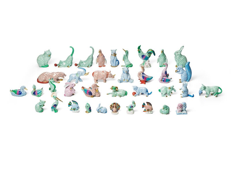 A Collection of Herend Porcelain Fishnet Animals: A Collection of Herend Porcelain Fishnet Animals comprising animals or animal groups including cats, rabbits, fish, ducks, owls, ram, seahorse, squirrel, rhino, elephant, leopard, rooster, peaco