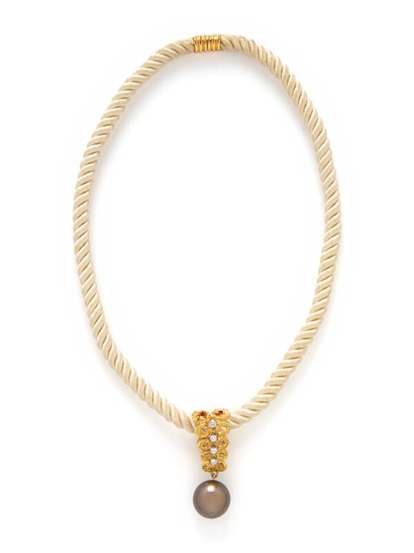 YELLOW GOLD, CULTURED BLACK PEARL, AND DIAMOND NECKLACE: YELLOW GOLD, CULTURED BLACK PEARL, AND DIAMOND NECKLACE Black cultured pearl measuring approximately 15.15 mm and round diamonds on a silk cord. Yellow gold. 17 inches long. Clasp stamp: 18K. Gross we