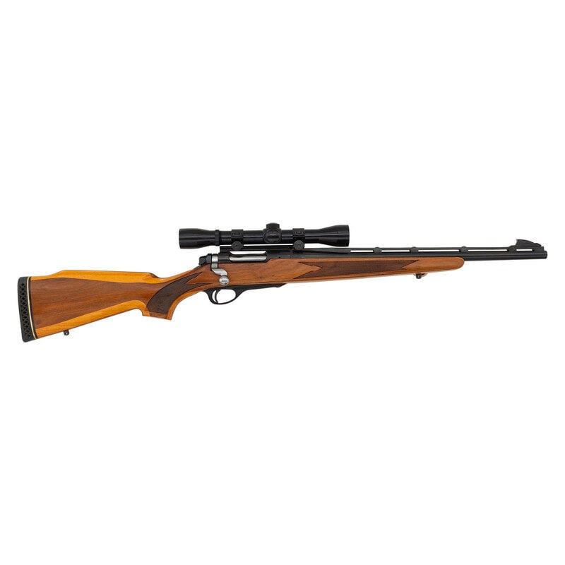 *Remington Model 600 .350 Rem Mag. with Scope: *Remington Model 600 .350 Rem Mag. with Scope .350 Rem. Mag. 18.5" barrel length. SN: 33794. Blued metal finish with black synthetic vented barrel rib and triggerguard set in laminated wood Monte-Carl