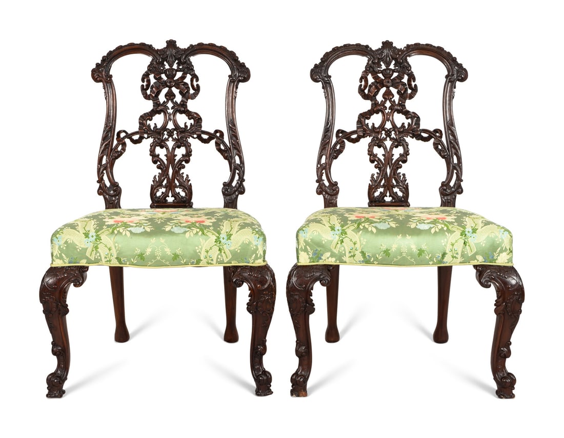 A Pair of George III Style Ribbon-Carved Mahogany Side Chairs: A Pair of George III Style Ribbon-Carved Mahogany Side Chairs Manner of Thomas Chippendale, Early 20th Century with embroidered silk upholstery. Of fine bench-made quality using traditional pegged joi