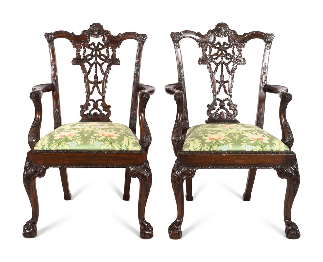 A Pair of George III Style Ribbon-Carved Mahogany Armchairs: A Pair of George III Style Ribbon-Carved Mahogany Armchairs Manner of Thomas Chippendale, Early 20th Century with embroidered silk upholstery. Of fine bench-made quality using traditional pegged joine
