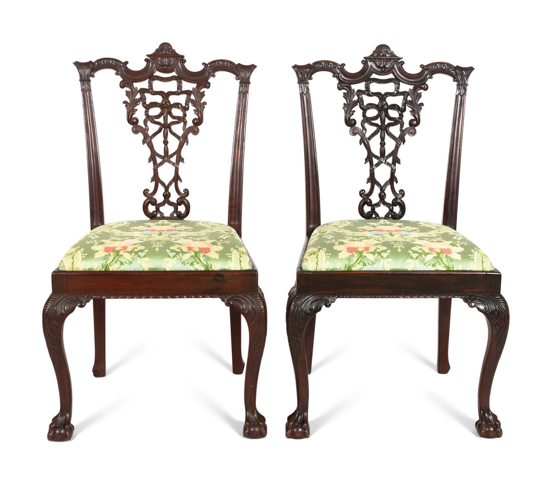 A Pair of George III Style Ribbon-Carved Mahogany Side Chairs: A Pair of George III Style Ribbon-Carved Mahogany Side Chairs Manner of Thomas Chippendale, Early 20th Century with embroidered silk upholstery. Of fine bench-made quality using traditional pegged joi