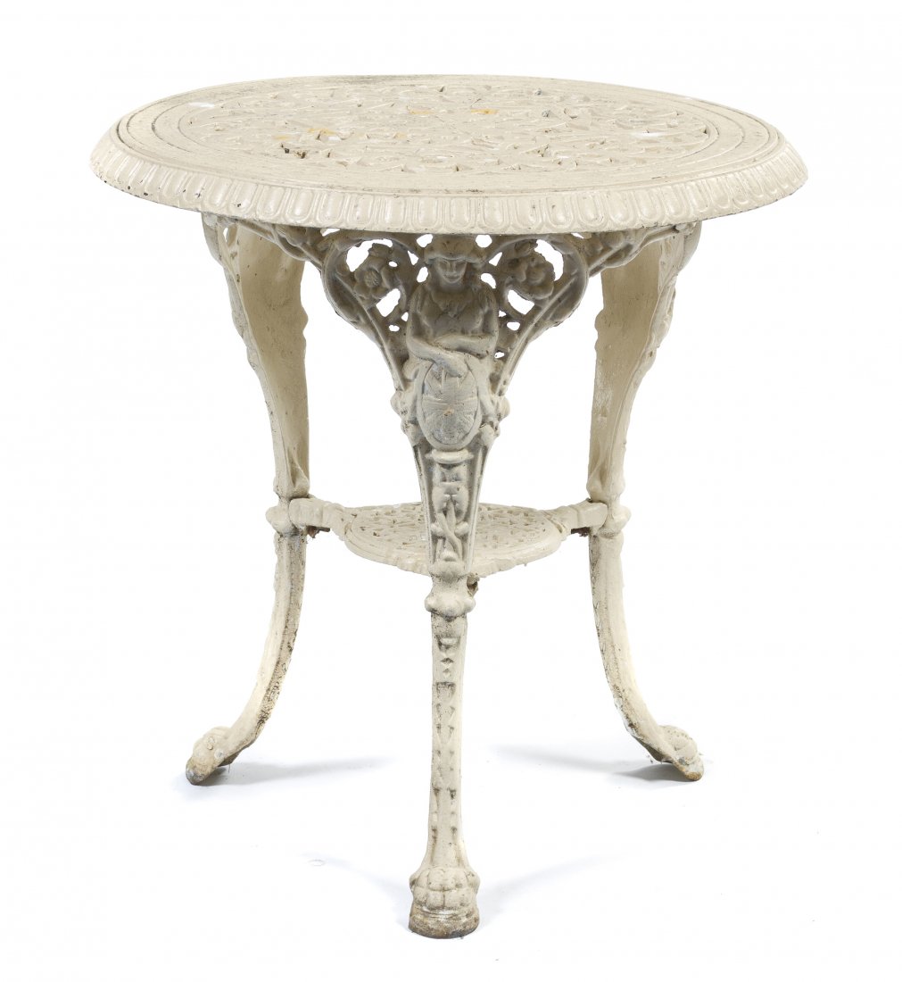 A Cast Iron Table, Height 28 1/2 x diameter 27 in: A Cast Iron Table, having a pierced circular top raised on three legs joined by a medial shelf. Height 28 1/2 x diameter 27 inches. Property from the Dr. Myrna Salud Living Trust, Marion, Indiana