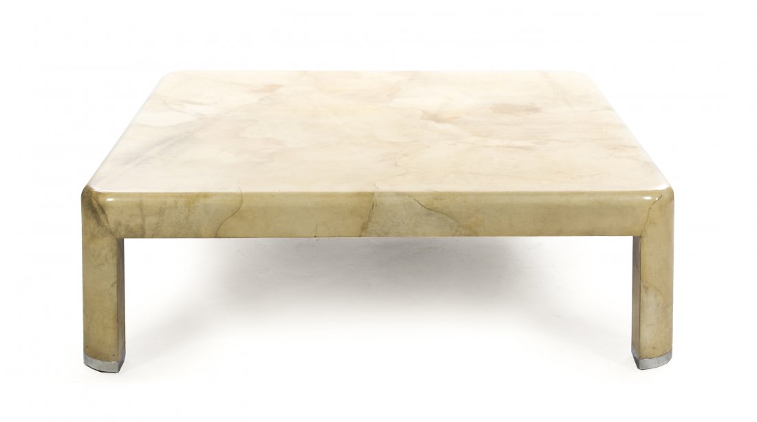 A Karl Springer Low Table, Height 16 1/4 x width: A Karl Springer Low Table, of square form with parchment veneer. Height 16 1/4 x width 53 1/2 x depth 53 1/2 inches. Condition: Light surface wear throughout, otherwise overall basic good condition. P
