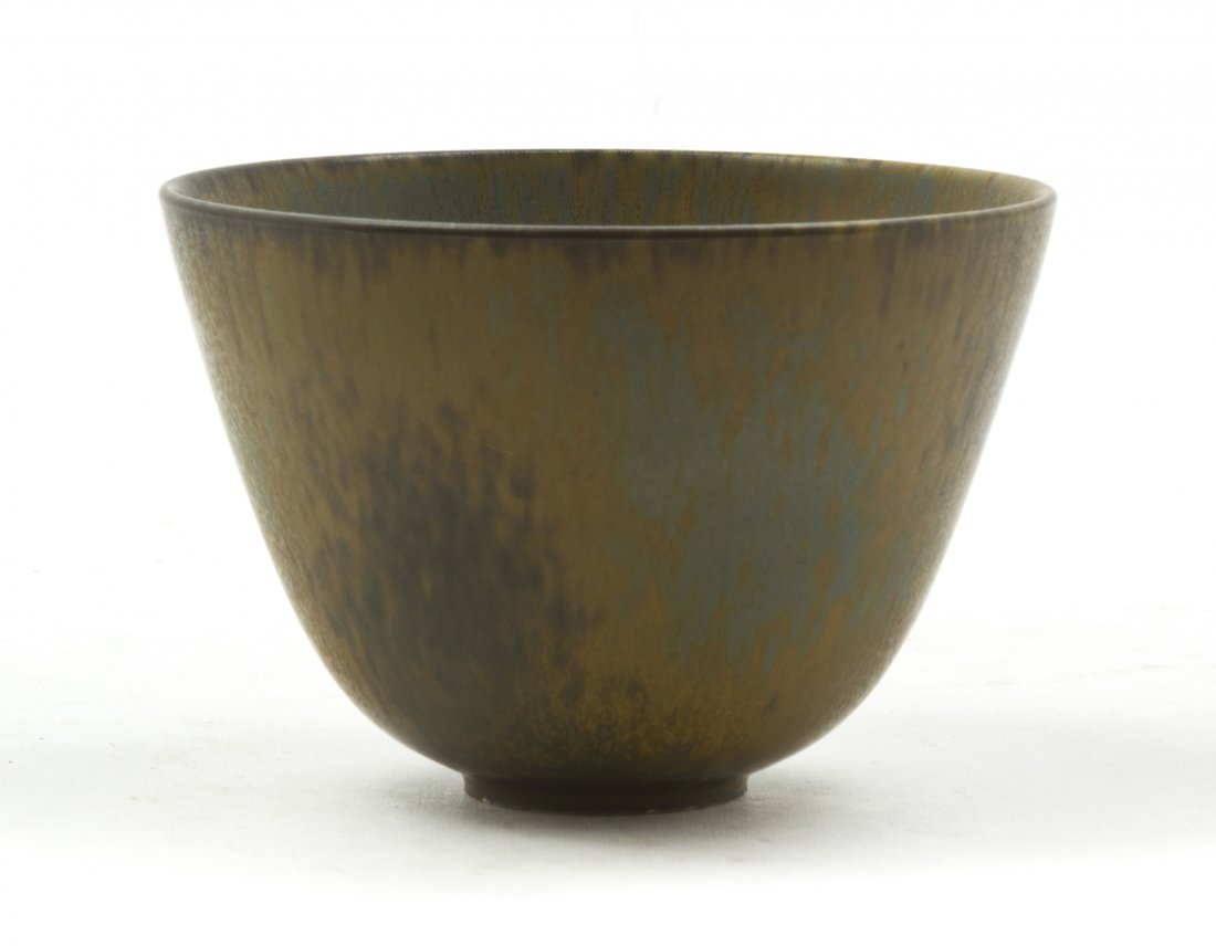 A Swedish Pottery Bowl, Gunner Nyland for Rorstra: A Swedish Pottery Bowl, Gunner Nyland for Rorstrand, of tapering footed form with mottled glaze, having three crown R mark, base further incised SWEDEN/GN/ARU. Diameter 5 inches. Property from the Eli