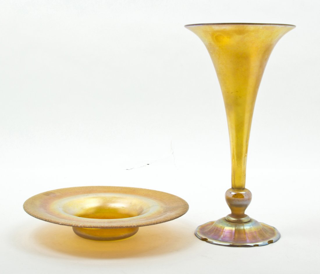 A Tiffany Studios Favrile Glass Trumpet Vase, Hei: A Tiffany Studios Favrile Glass Trumpet Vase, signed 108L, L.C. Tiffany-Favrile, together with a Tiffany favrile low bowl. Height of first 13 3/8 inches. Property from the Dr. Myrna Salud Living Trust