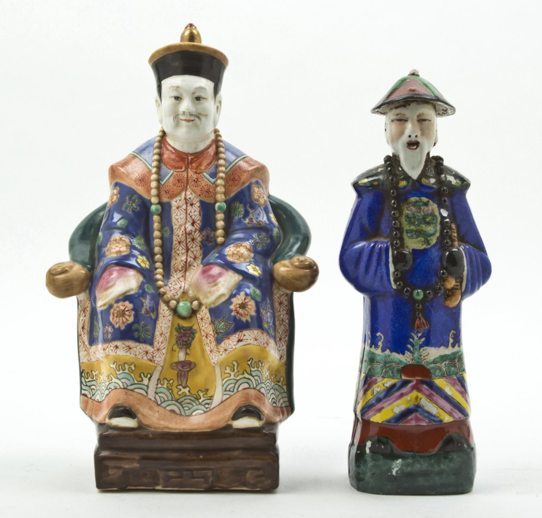 A Group of Two Enameled Porcelain Figures, Height: A Group of Two Enameled Porcelain Figures, one depicting a Qing dynasty court member in a dragon robe, the other a Qing dynasty seated official in a yokeback armchair. Height of taller 12 inches.