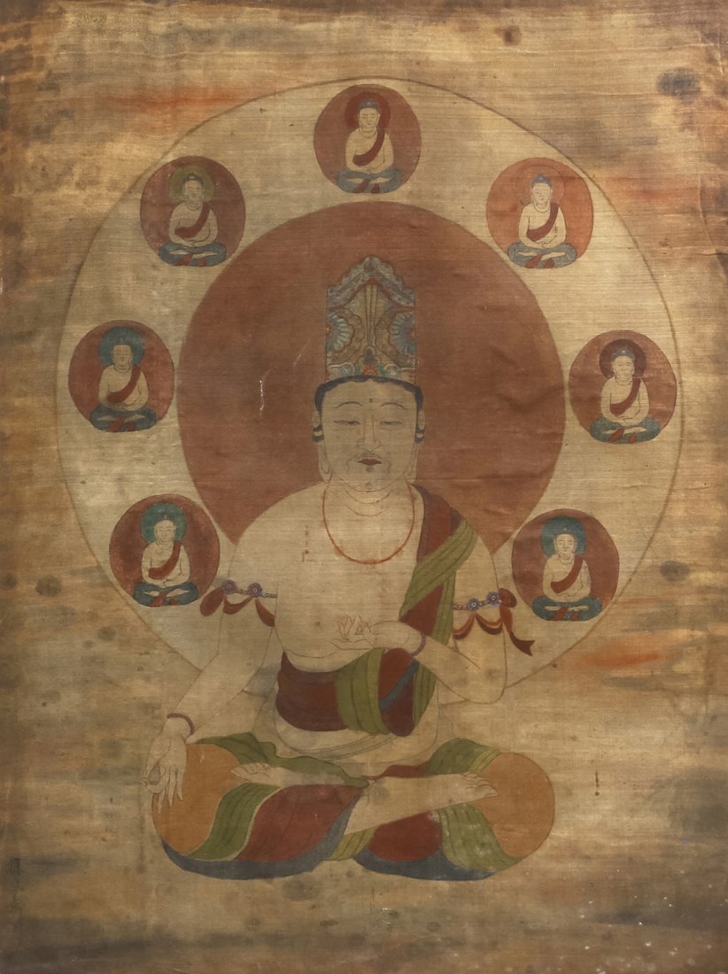 A Korean Buddhist Painting on Silk, Height 20 1/2: A Korean Buddhist Painting on Silk, depicting a central deity seated in padmasana, having seven deities in a circular mandorla behind the figure. Height 20 1/2 x width 15 1/4 inches.