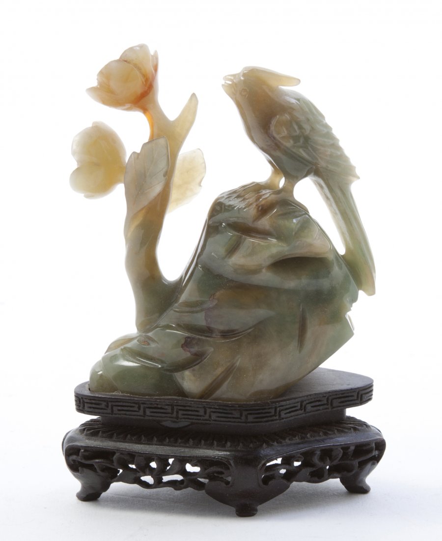 Two Chinese Agate Carvings of Birds, Height of fi: Two Chinese Agate Carvings of Birds, the first of opaque green, russet and cream colored stone with transparent russet banding, the bird perched atop a rocky mound looking at a flowering peony, the se