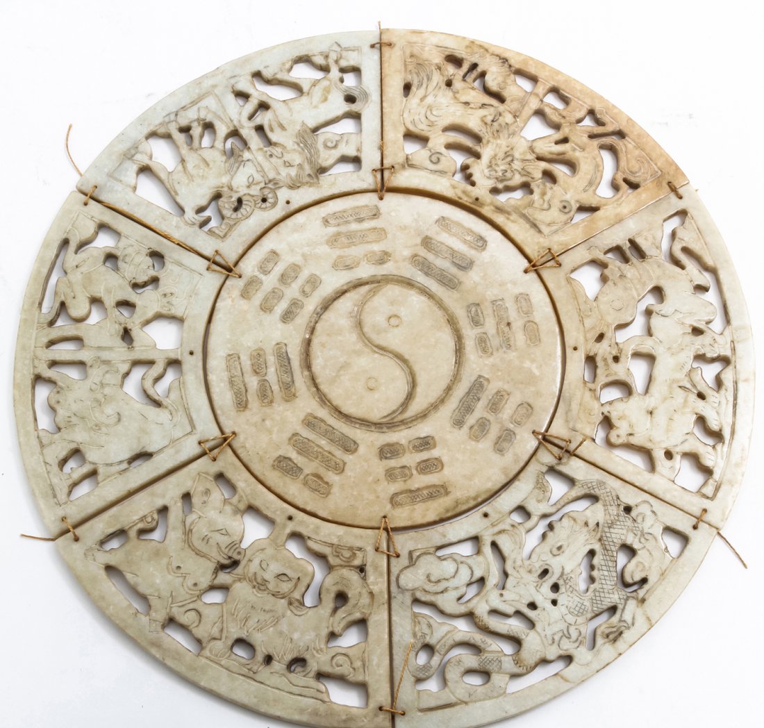 A Chinese Carved Soapstone Zodiac Plaque, Diamete: A Chinese Carved Soapstone Zodiac Plaque, having six pierce carved and conforming radial sections surrounding the central medallion having trigrams around a yinyang. Diameter 13 inches.