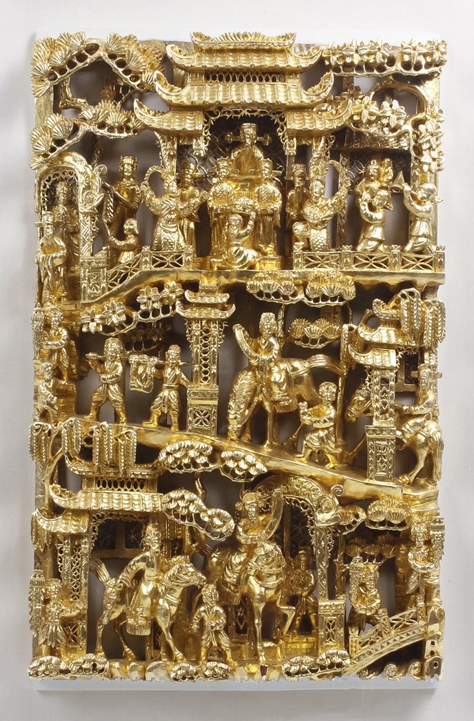 A Chinese Gilt Relief Carved Panel, Height 19 x w: A Chinese Gilt Relief Carved Panel, depicting a procession in multiple tiers, the top tier having a seated official with attendants, with pine trees and architectural elements throughout, in a plexigl