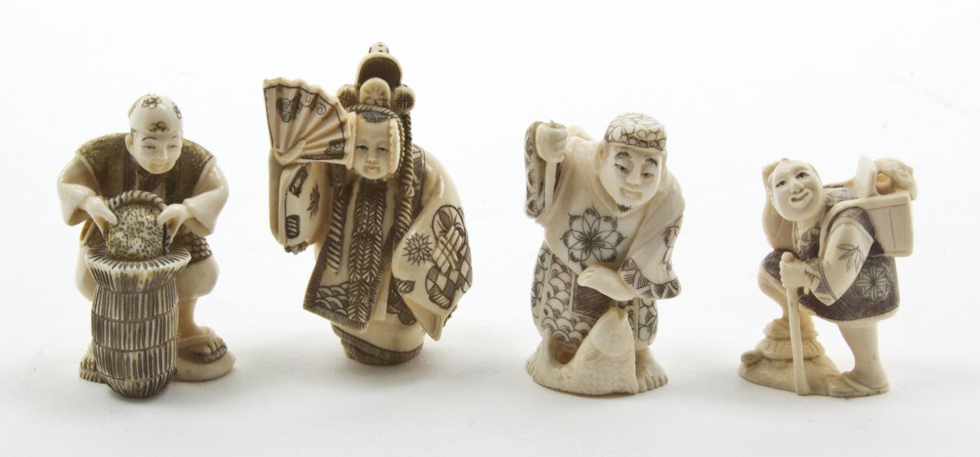 A Group of Four Japanese Carved Ivory Netsuke, He: A Group of Four Japanese Carved Ivory Netsuke, two depicting laboring peasants, one depicting a man with a fish, one a kabuki actor. Height of tallest 2 1/4 inches.