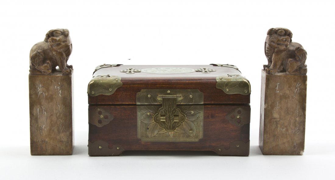 A Pair of Chinese Carved Soapstone Seal Stamps, H: A Pair of Chinese Carved Soapstone Seal Stamps, together with a hardwood brass mounted jewelry box. Height of first 5 1/2 inches. Property from the Elizabeth Price Welch Legacy Collection, Chicago, Il