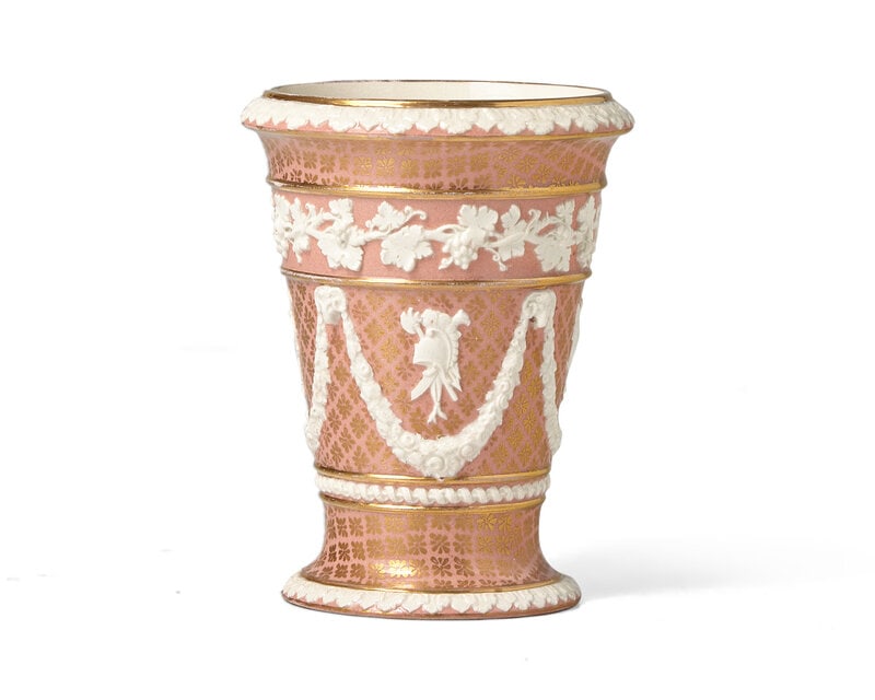 A Wedgwood Neoclassical Parcel-Gilt Vase: A Wedgwood Neoclassical Parcel-Gilt Vase Late 19th Century Modeled with grape vine banding over floral swags; impressed Wedgwood stamp. Height 5 3/8 x diameter 4 1/8 inches. Pr
