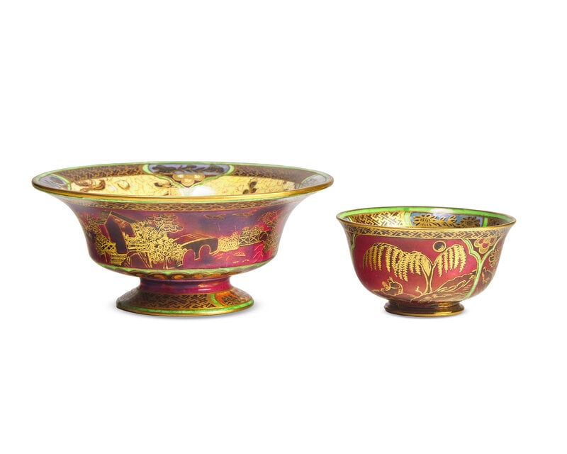 Two Wedgwood Fairyland Lustre 'Daventry' Parcel-Gilt Footed Bowls: Two Wedgwood Fairyland Lustre 'Daventry' Parcel-Gilt Footed Bowls Early 20th Century Each exterior with gilded landscape on a ruby ground, the interior with blue center and wide yellow border, printed