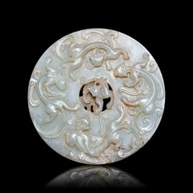 A Chinese Pale Celadon Jade 'Chilong' Bi Disk 青玉螭龍紋璧