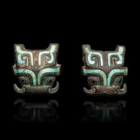 A Pair of Chinese Turquoise and Glass Inset Bronze Beast Mask Harness Ornaments, Late Western Zhou