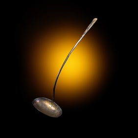 A Chinese Parcel-Gilt Silver 'Peony' Ladle, Liao Dynasty 遼 銀局部鎏