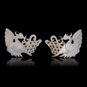 A Pair of Chinese Pale Celadon Jade 'Peacock' Hat Ornaments, Jin Dynasty 金 白玉